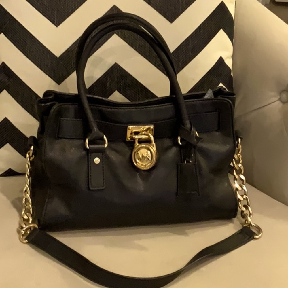 Michael Kors Leather Satchel with Lock handbag with detachable shoulder strap.